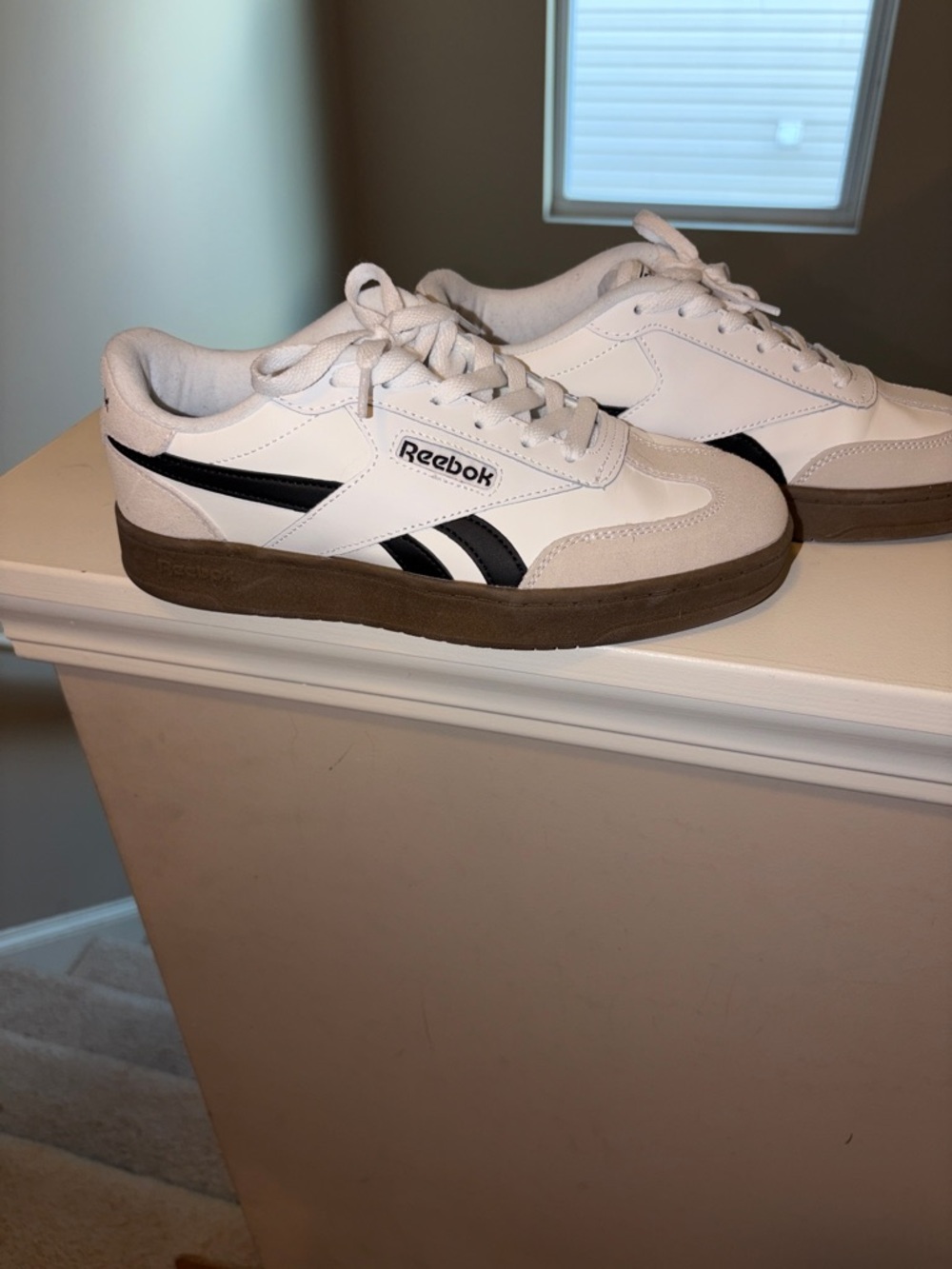 Reebok Woman’s White Sneakers with Black Stripes and Brown Sole